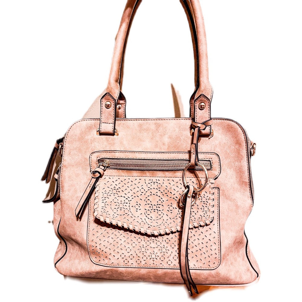 A tan vintage bag. Multiple pockets. From Buckle.